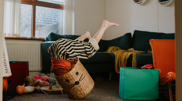 Child plays in basket