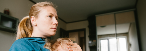 Mother cares for child while working