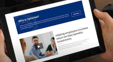 hands holding tablet with website