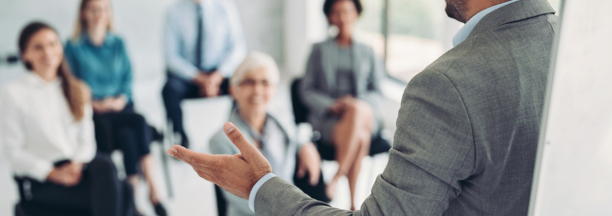 Employer giving a presentation to employees. 