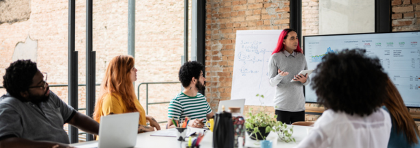 Group of diverse employees working together in a conference room.