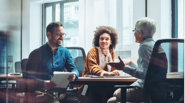 Group of employees meet