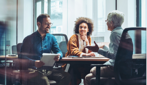 Group of employees meet