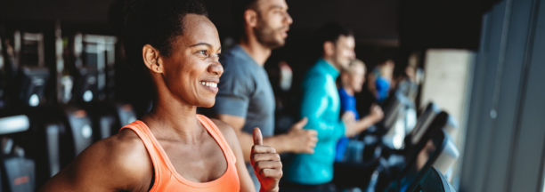 woman jogging on treadmill in gym